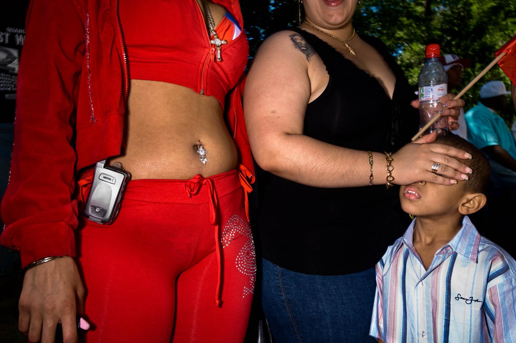 Moments in America.  From a series of photographs at the Puerto Rican Day Parade in New York City along Fifth Avenue. : THOUGHTS of the MOMENT : Salem Krieger