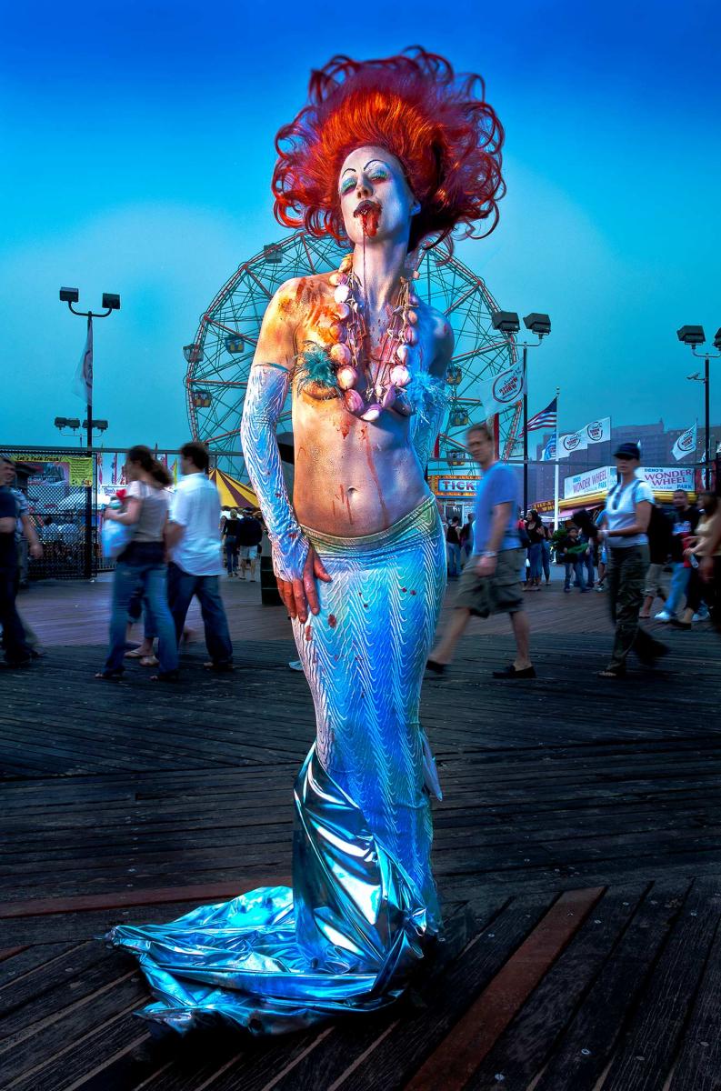 Moments in America. From a series of photographs at Coney Island, New York during the Mermaid Parade. : THOUGHTS of the MOMENT : Salem Krieger
